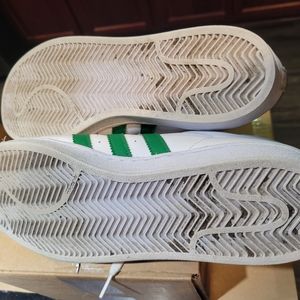 White and green Adidas sneakers
